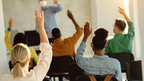 Image of High School Students raising hands