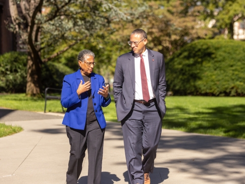 Image of Denise Rodgers walking with Rutgers President, Jonathan Holloway