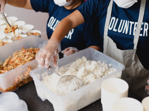 Image of volunteers serving bulk meals